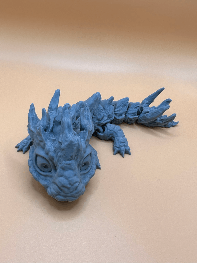 Articulated stone baby dragon