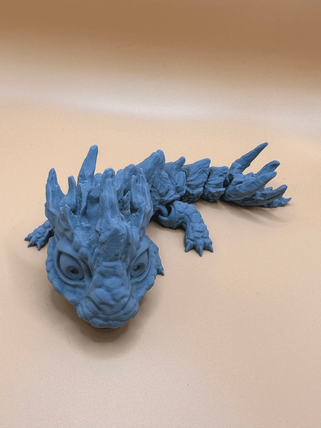 Articulated stone baby dragon